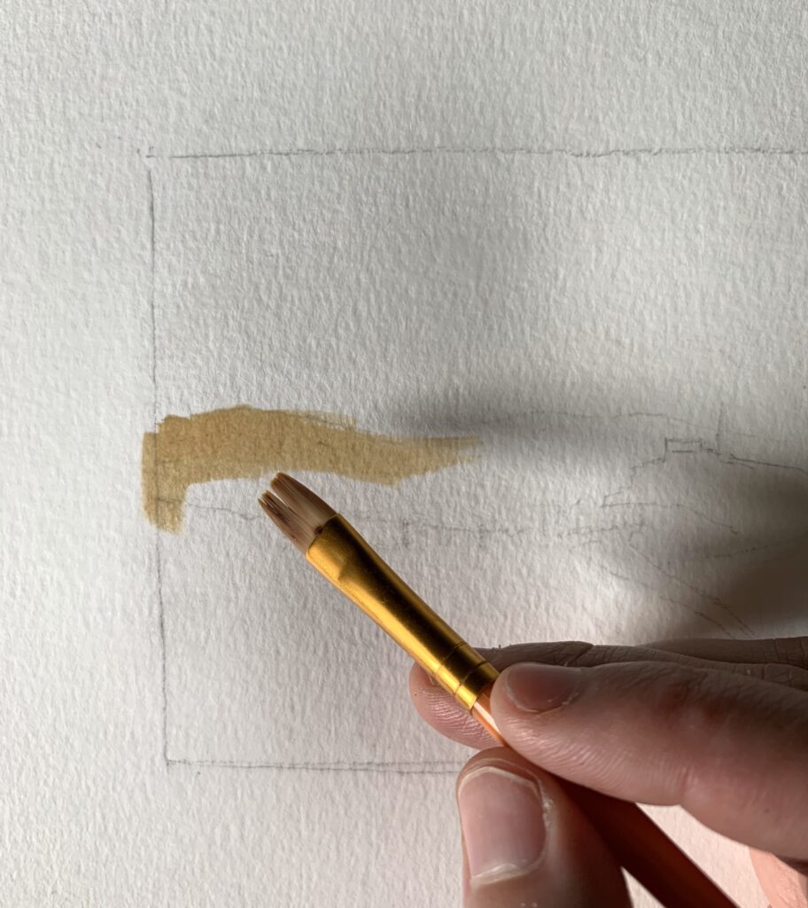 applying coffee watercolor paint to watercolor paper