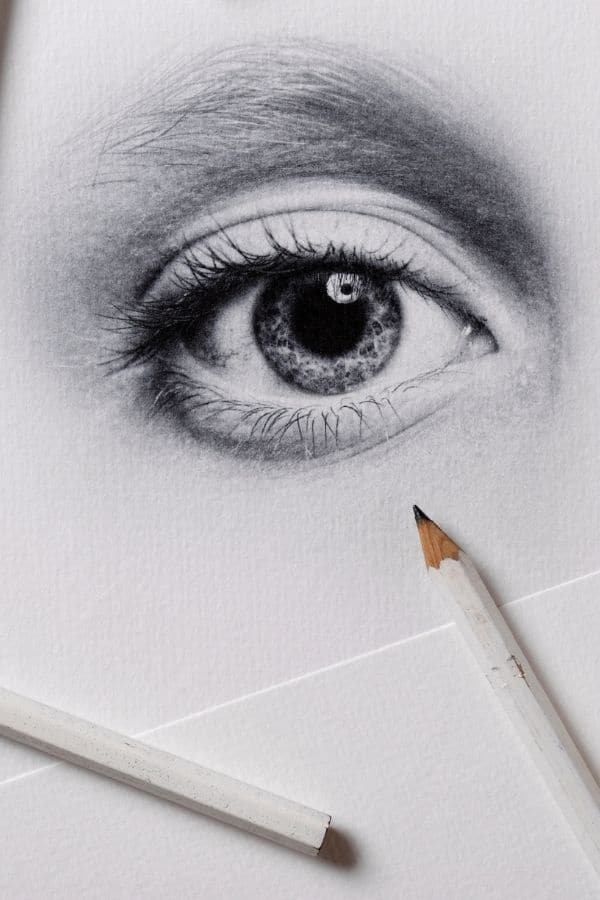 ideas for drawing of an eye close up with a white pencil ready to go