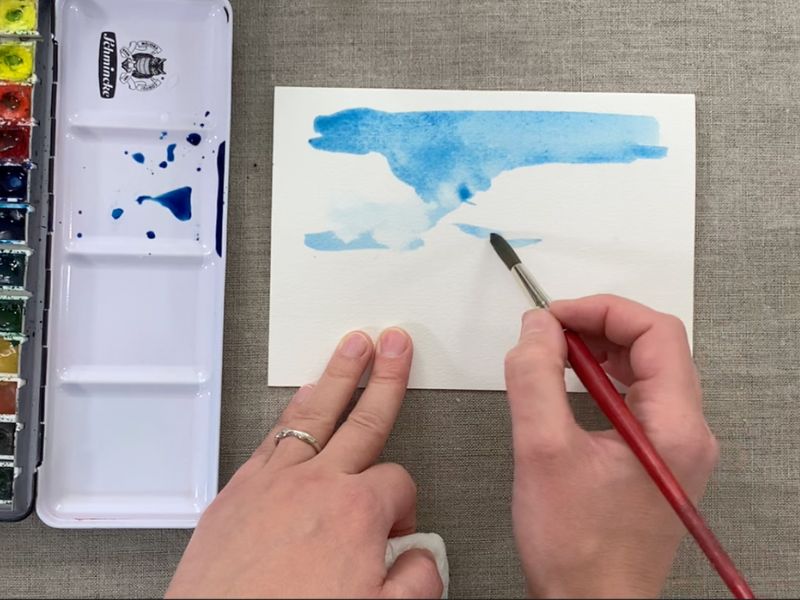 Painting the sky first in a watercolor landscape painting