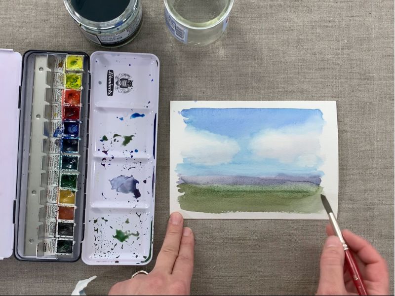finishing a field in a watercolor landscape painting